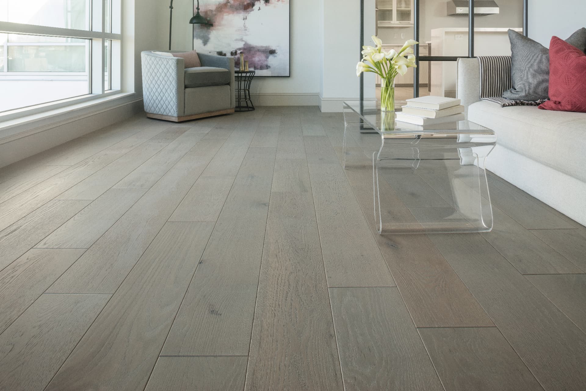 Wide-plank oak flooring installed in a bright Central Minnesota living room